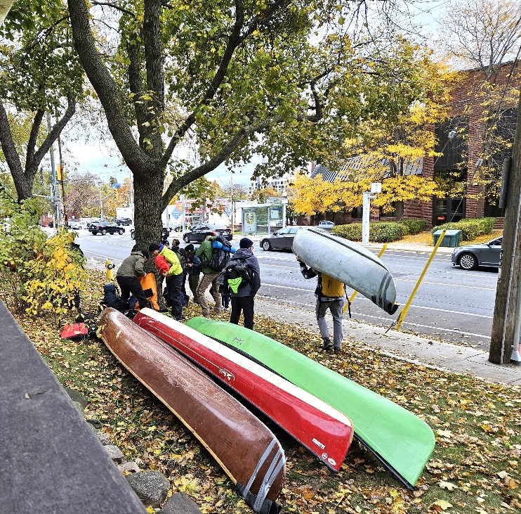 Canoes being portaged along Davenport Road