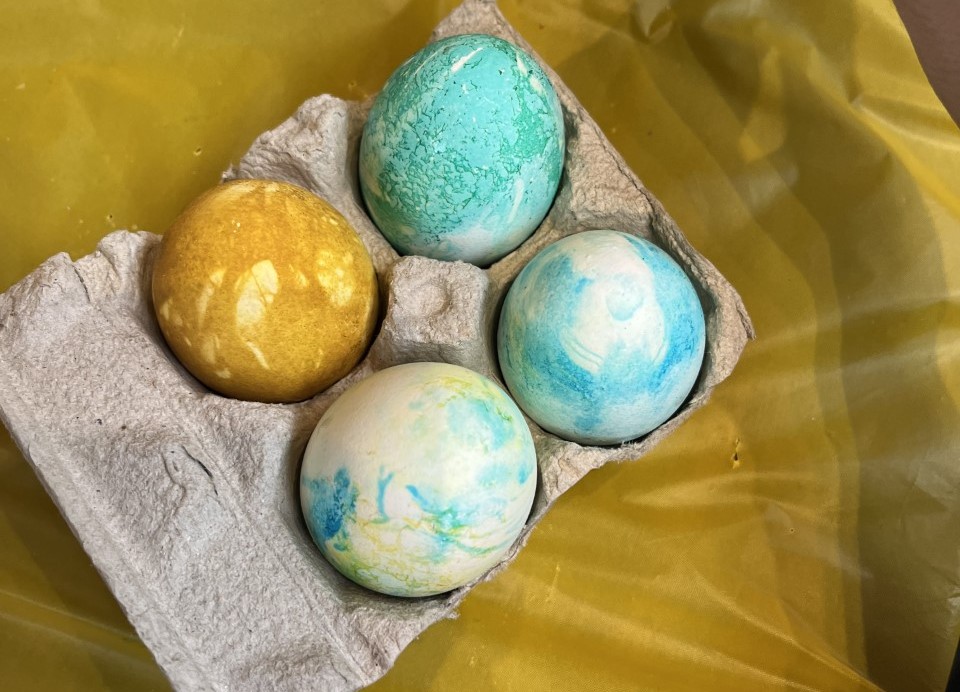 Four eggs dyed with natural vegetable dyes