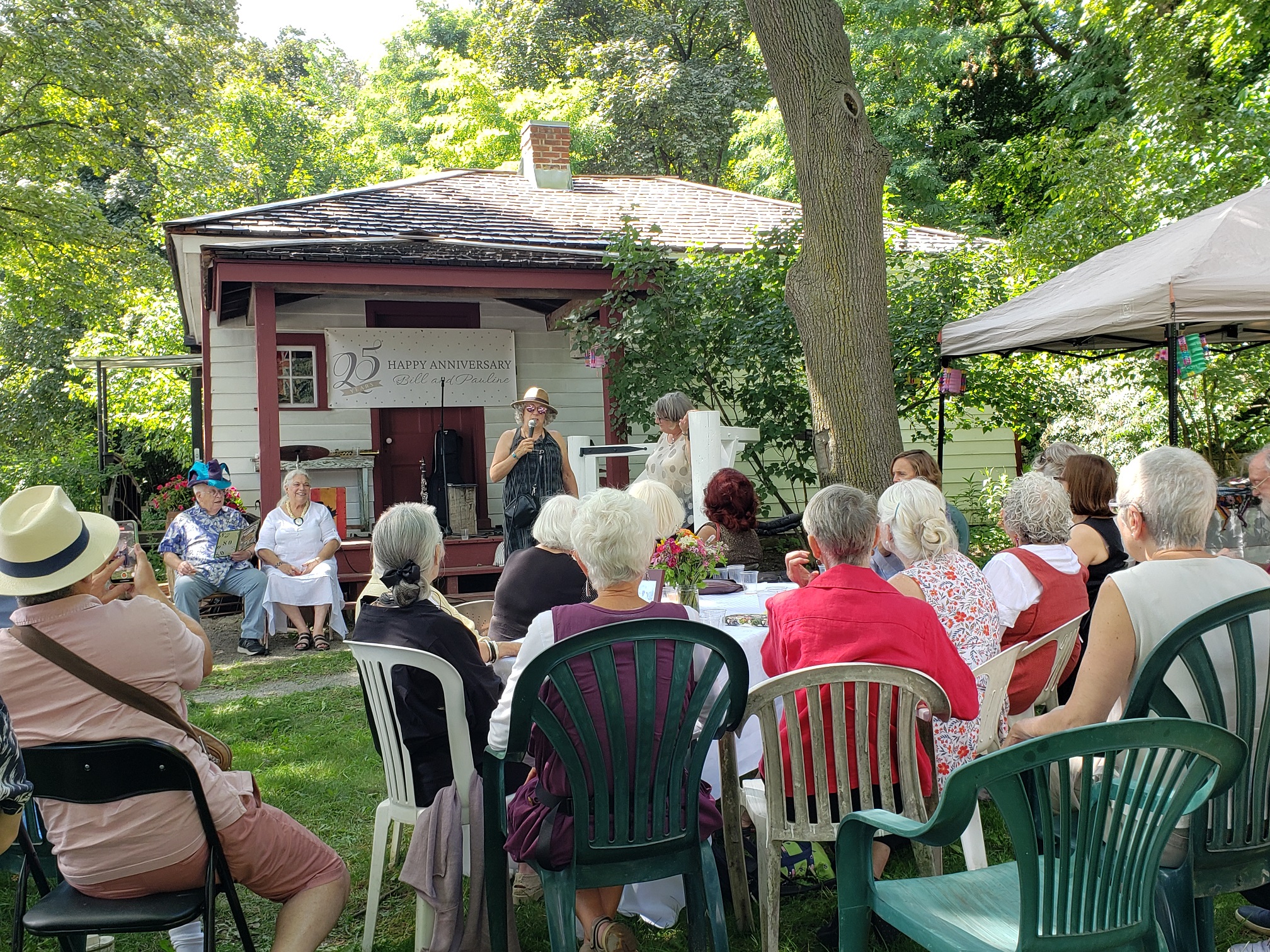 Guests gathered on the grounds for an anniversary celebration at the Tollkeeper's Cottage