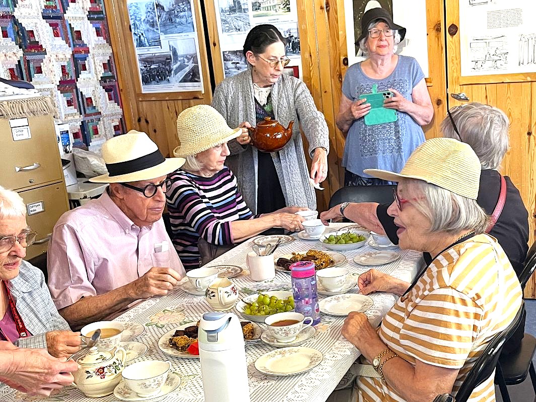 A seniors' group enjoying tea after a visit to the Tollkeeper's Cottage